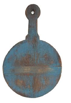 **SOLD** M12 Early 19th century wooden Peel Board / Cutting board with shaped handle and hole for hanging with remnants of its original blue painted surface on one side and natural patina on the reverse. The runners you see showing are actually the bottom of the peel board, but for display purposes, it looks more interesting with the runners showing. The opposite side is perfectly flat for working on and bears wonderful patina from years of use. Measurements: 25 &frac14;� long x 16� wide x &frac34;� thick. 