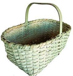 H223 Rectangular gathering basket in original light green paint. Extremely sturdy woven basket boasts double steamed and bent rims that are single wrapped and a thick, steamed and bent handle that is notched and woven into the sides of the basket