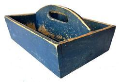 J352 19th century Pennsylvania original Soldier Blue painted Cutlery tray / knife box with curved center divider featuring an oval cutout for carrying purposes. Slightly canted sides. Square head nail construction. Very dry surface with wear indicative of use. Circa 1840 � 1850�s. Measurements: 13 &frac14;� x 11 3/8� x 6� tall (center).  The sides are 4� tall.
