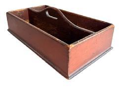 L420 19th century Pennsylvania Cutlery Tray / Knife Box retaining its original red painted surface. Raised curved center divider features cut out for carrying purposes. Molded edge surrounds the bottom. The wood is pine � with tiny square head nail construction. Very dry surface with wear indicative of use. Circa 1840 � 1850�s. Measurements: 16 &frac34;� wide x 9 &frac12;� deep x 3 &frac34;� tall sides x ~5 &frac12;� tall at handle. 