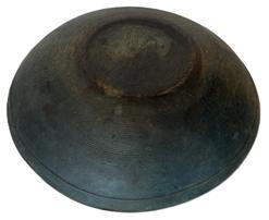 **SOLD** RM1563  Early 19th century New England wooden turned bowl in original blue paint. Bowl is slightly out of round, features a band around the rim and shows strong evidence of slow lathe turning on both the interior and exterior. Natural patina interior with a few surface age cracks that do not go all the way through the bowl. Great wear from years of use. Measurements: 12 &frac14;� x 11 &frac12;� diameter. 2 &frac14;�- 2 &frac12;� tall, depending on where measured. 