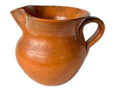 **SOLD** K1835 Beautiful orange glazed (�Tobacco�) Jugtown Ware Pottery Pitcher from Jugtown, North Carolina. Stamped �Jugtown Ware� on bottom. Great condition. Measurements: 7 &frac14;� across spout to handle. 3 &frac12;� diameter bottom. Stands 5 &frac14;� tall.  