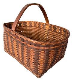 K1837 Spectacular Eastern Shore, Maryland Basket featuring a double banded, single wrapped rim. The steamed and bent handle is actually one solid piece of wood that encircles the center of the basket and is incorporated into the weave. Nice, tight weave, featuring two different brown colored oak splint slats.  Very sturdy. Excellent condition. Measurements: The opening is 13 &frac14;� long x 9� wide. Rectangular bottom is 10 &frac12;� long x 8� wide. Sides are 6 &frac14;� tall. Overall height at handle is approximately 10 &frac14;� tall. 