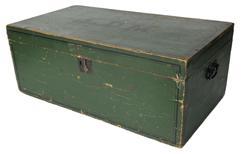 K220 New England storage box / trunk retaining original green painted surface with the initials �L.D.M.� hand painted in black on the top of lid. The top, front and sides of the box are adorned with a pinstriping detail also hand painted in black. Original forged iron handles remain intact on each end. Clean, natural patina interior with applied interior molding around the opening to help keep dust and moisture from seeping inside the box. Pine, one board, dovetailed and square head nail construction. Circa 1850s-1860s. Measurements: 29� wide x 15 &frac34;� deep x 11 &frac14;� tall.  