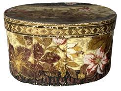 K254 Dated and identified 19th century Pennsylvania oval wallpaper box signed �Laura Krauss 1832� in pencil on the bottom.  The box is paperboard, hand stitched construction and is covered in a floral wallpaper in rich earth tones. Nice condition. Measurements:  8 &frac14;� long x 6 &frac12;� wide x 4 3/8� tall. 