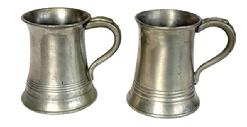 L269A Pair of Pewter mugs � each is marked �&frac12; Pint�. One has the initials "M.b." engraved on the bottom. Each measures approximately 3 3/8� bottom diameter x 3� top diameter x 4� tall.  