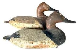 L259 Rig Mate Pair Canvasback Decoys carved by Will Heverin (1860-1951) from Charlestown, Maryland bearing very early working repainted surfaces. Both are Branded �PM� on bottoms of tails � which stands for the Paul Murphy Rig. These were found in a rig in Kennedyville, MD.