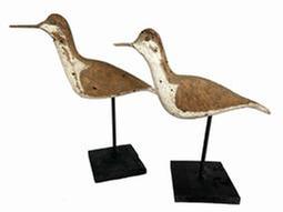 K66 Early 20th century pair of Shore Bird rig mates � each is branded "T. SMITH". They have wooden beaks/bills, tack eyes and the surfaces bear remnants of original paint as well as evidence of being shot over. Mounted on newly made, black painted wooden bases for display purposes. Each bird measures approximately 11� long x &frac34;� wide x 5 &frac12;� tall. Mounted heights are 9 &frac12;� tall and 10 &frac12;� tall.   