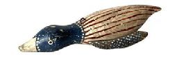 J344 Hand carved Folk Art Patriotic Duck shaped fish decoy featuring original red, white and blue painted surface. Wooden body with stationery tin wings and loose tin �feet� featuring painted details on all tin to match the body paint. Painted eyes. Solid wood body with a metal weight embedded into the duck�s underbelly. From a Wappinger Falls, NY collection. Approximate measurements:  9 &frac12;� long x 3 5/8� wide x 1 &frac12;� tall