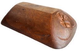 SP13 Wooden trencher bearing hand carved flower blossom on each end and hand carved wheat on each side. A double beaded edge encircles the top lip/rim with hand carved decoration within the lip on each end. Hand chopped construction from a single piece of wood with natural finish. Wonderful natural patina interior with evidence of significant chop and tool marks from years of use. The wood appears to be walnut. Measurements: 20 &frac14;� long x 13� wide x 4 &frac14;�-4 &frac12;� tall, depending on where measured. Trencher sides taper down to a flat bottom area that measures 11 3/8� long x 3 &frac14;� wide.