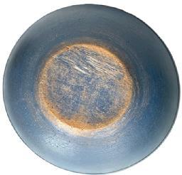 J421 19th century wooden bowl with lipped rim, distinct turnings and slightly tapered / raised foot bearing a beautiful original blue painted surface and natural patina interior with evidence of slow turnings and chop marks from use. Slightly out of round. Very sturdy � with tight age crack to rim. Measurements: 14 &frac12;� x 15" diameter (out of round) x 3 &frac34;� tall.  