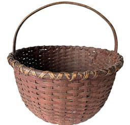 **SOLD** K1626 Sturdy 19th century original dark red painted round woven splint basket with hand-carved steamed and bent handle that is woven into the sides. Double wrapped rim. The tightly woven bottom includes a slightly bumped up interior for airflow. Measurements: 15� top diameter x 16� tall with handle. The sides are ~8 &frac12;� tall. 