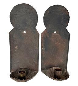 L435A Pair of matching late 18th century to early 19th century single-candle sconces with deeply fluted candle cups. The rolled tin / sheet metal construction features rounded tops, punched wriggle-work designs and rolled edges on the backs. Most American homes were lit with simple candle sconces such as these. This pair of New England Sconces have the best, uncleaned surface and remain in good original condition. Each sconce measures ~4 &frac12;� wide x ~3 &frac12;� deep x ~10 3/8� tall.  