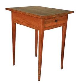 18th century Maryland pumpkin painted Hepplewhite one drawer table boasting long, delicately tapered legs and one dovetailed drawer. Rosehead nail construction with the apron of the table being mortised into the legs and secured with wooden pegs. A distinctive pinwheel carved into each outer side of the drawer is visible when the drawer is removed. Great size and height! Measurements: 21� wide x 25� deep x 30 &frac14;� tall. (24� from apron to floor)