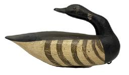 M230 Brandt Decoy in a preening pose - carved by Gary Crossman ( d 2007) of Chincoteague, Virginia. Decoy bears tack eyes and original painted surface with its original weight and staple intact on bottom. Measurements: 13 &frac12;� long x 4 &frac12;� wide x 7 &frac12;� tall. 