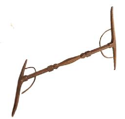 L405 Early 19th century handmade Niddy-Noddy yarn winder with decorative carved center shaft, steamed and bent supports for the fully mortised and pegged ends. Natural patina surface. Circa 1800-1810. Each end measures approximately 12 &frac14;� wide and overall length is 18� long. NOTE: These were essential items for hand spinners to wind yarn their newly spun wool yarn into skeins by repeatedly winding the yarn over, around and over the cross bars until it equaled twice the bar�s length to be considered a full skein. 