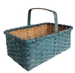 **SOLD** M141 Early 20th century hand woven splint Basket from Eastern Shore, Maryland with beautiful blue paint. Sturdy rectangle shape with a double wrapped, double rim and a steamed and bent handle that is woven into the sides and secured with tiny tacks. Natural patina interior. Very good condition. Measurements are: 18 &frac14;� long x 13" wide x 13" tall including handle. The sides are 7 &frac12;� tall. 