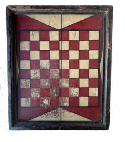 M102 Outstanding 19th century original painted checkers game board shows an outstanding original painted wood surface with applied molding surrounding the edges. The playing field is painted in red and white with black outlining on a red background, with white painted triangular designs outlined in black adorning all four sides of the playing field. Shaped applied molding secured with square head nails surrounds the entire board and retains remnants of several layers of paint, including bittersweet red and gold gild. Measurements: 18� wide x 1 &frac14;� thick x 22 &frac14;� tall.  
