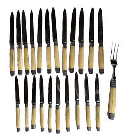 **SOLD** L352A Group of early Knife set and Meat Fork with carved ivory or bone handles and silver accents. Grouping includes (10) knives ~8� long, (12) knives ~9 &frac34;� long and (1) meat fork approximately 11� long. Very good condition with a few age / drying splits visible in the handles. The end cap of one of the 8� long knives has been replaced. Blades are sharp steel with no visible corrosion. Unmarked. Estimated to be from the Victorian era � Circa 1850s-1880s.   