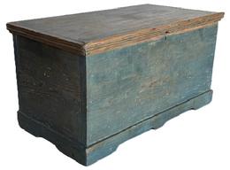 **SOLD** CM5 Late 18th century Mid-Atlantic miniature blanket chest retaining original blue painted surface with applied reeded molding around the lid and an applied bracket base. Clean, natural patina interior. Six board yellow pine wood with small rosehead, and �T� nail construction. Measurements: 20 &frac14;� wide x 10 5/8� deep x 10 &frac14;� tall. 
