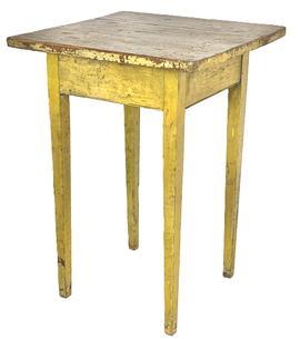 J460 Early 19th century Pennsylvania Hepplewhite table / stand boasting its original vibrant yellow painted surface. Two board top with fully mortised and pegged, beaded edged apron resting on long, delicately tapered legs. 