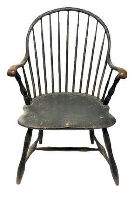 M241 Late 18th century Delaware Bow-back Windsor armchair retaining beautifully worn black over original salmon painted surface. Sturdy steamed and bent arms end in carved knuckle handholds. One board seat. Nice turnings.  Great wear � especially on each of the arms and seat front. The chair measures 22� wide across front of arms. Seat is 17 &frac14;� deep x 19� wide x 16 &frac12;� tall from floor. Overall height of chair back is 37� tall. 