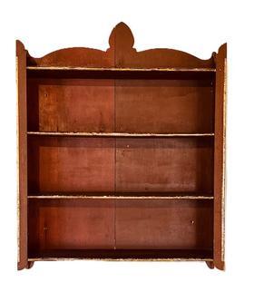 L96 Unique 19th century hanging wall shelves with shaped sides and shaped cutout on back retaining the original red painted surface. Unusual gold gild molded insert edges adorn the shelf fronts and each front corner. Small wire nail construction. The woods are pine and poplar. Circa 1870-1900. Measurements: 26� wide x 6 3/8� deep x 33 &frac12;� tall (back center).  