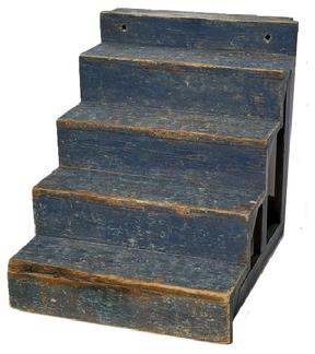 M155 Early 19th century Pennsylvania Country Store display shelf / steps bearing original dry, dark blue painted surface. Pine with small wire nail construction. Overall measurements: 20� wide x 23 &frac34;� deep x 22 &frac12;� tall. The shelves/steps are 5� deep x 4 &frac12;� tall. The top shelf/step is 5� deep x 3� tall. 