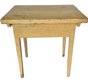 L541 Late 18th to early 19th century Pennsylvania pin top worktable with an extra thick one-board top and mortised and pegged apron resting on sturdy, gradually tapered legs bearing its original creamy pale-yellow painted surface. The top is attached to the base via a stretcher beneath each side that is mortised/dovetailed into the top and attached to the base with thick wooden pegs (see photos). These stretchers kept the top from twisting/warping over time. The top is actually one board that has split across the center from age. The apron is fully mortised and pegged into the gracefully tapered legs. The wood is pine. Measurements: 30 &frac14;� wide x 24� deep x 30 &frac34;� tall. The top is a full 1 5/8� thick. The boards that make up the apron are a full 1� thick. Clearance from apron to floor is 22 &frac12;�.  