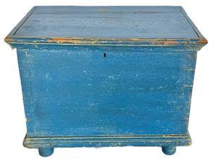 **SOLD** M139 18th century Eastern Shore, Maryland Miniature Blanket Chest retaining blue painted surface. Six-board yellow pine with dovetailed case and applied moldings to top and bottom, resting on turned feet. Prominent wooden peg construction throughout, with a few �T� and rosehead nails visible. Natural patina interior. Circa 1780-1800. Measurements: 16 &frac14;� wide x 11 &frac14;� deep x 12 &frac12;� tall.  