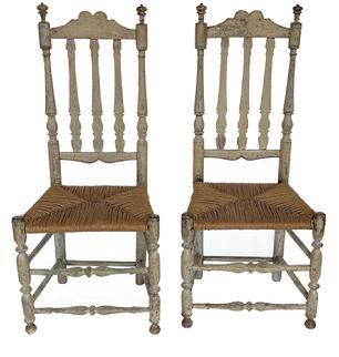 L53 Rare pair of 18th Century New England William & Mary style triple Banister Back side chairs with rush seats, great carved crests and delicate turned finials. Both chairs bear original old multi-layer painted surfaces. Circa 1740s-1760s. From Connecticut.  Measurements: 19� across fronts x 14 &frac14;� deep x 43 &frac12;� tall (back) x 17� tall (seat height). 