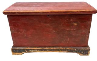 **SOLD** M26 Late 18th century Maryland blanket chest bearing original red paint with applied bracket base bearing original black painted surface and cut out feet. The initials �J.C� are painted inside the lid. Pine, six board construction with a combination of �T� nails and rosehead nails and applied, hand planed molding around the lid. Clean, natural patina interior. Circa 1790s-1800. Measurements� 31 &frac12;� wide x 15� deep x 18� tall.    