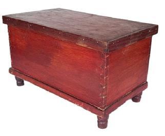 LL138  19th century miniature Pennsylvania blanket chest with original red painted surface bearing applied molding around lid that opens to reveal clean, natural patina interior with a small lidded til inside. Chest rests on applied turned feet. Small square head nail construction. The wood is pine.  Circa 1850s-1880s. Measurements:  15 &frac34;� wide x 9 &frac14;� deep x 9 &frac14;� tall.  