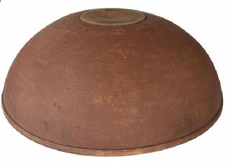 H466 - 19th Century Pennsylvania extraordinary wooden bowl in original salmon paint. Bowl boasts a chamfered interior lip with a distinct molded rim around the top outer edge and rests on an ever so slightly raised foot.  Very heavy and sturdy.  Measurements: 19� x 19 &frac14;� diameter x 6 &frac14;� deep. Raised foot area measures 5� x 5 1/8� diameter
