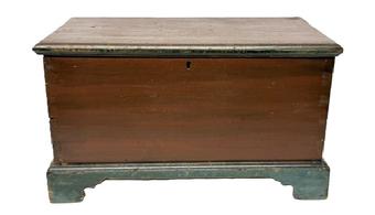 M1121 Early 19th century Pennsylvania original red and blue painted child's size blanket chest with dovetailed case and applied bracket base with cut out feet. The wood is poplar, six board dovetailed construction with applied molding surrounding the lid. The molding and bracket base are secured with wooden pegs. Clean, natural patina interior with small, lidded till. Circa 1800-1820s. Measurements: 20 &frac12;� wide x 11� deep x 11 &frac34;� tall. 