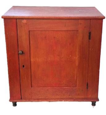 M146 Mid-19th century York County, Pennsylvania one door cupboard with original red painted surface and turned feet. The fully mortised door is surrounded with a crisp beaded edge and opens to reveal a clean, natural patina interior with sturdy shelves. Pine, one board square head nail construction. Circa 1850s. Measurements: 31� wide x 20� deep x 31 &frac34;� tall. 
