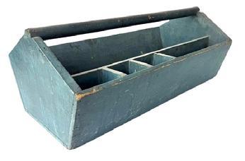     E121 Late 19th century Tool Carrier/ Carpenter's Tote bearing wonderful original dry, weathered blue paint. This carrier features nice, high angle-shaped ends with canted sides and a deep well outfitted with a stationary tray with sections for various nails/tacks, etc. The wood is pine with wire nail construction. This is a true country classic with beautiful blue paint.   Measurements: 26 &frac34;� long x 14 &frac14;� wide x 10 &frac12;� tall at handle. The sides are 6 &frac14;� tall.           