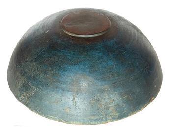 **SOLD** L137 Outstanding large, original dry blue painted 19th century turned wooden bowl from a private new England Collection with slightly raised footed base boasting beautiful original blue painted surface showing great wear from years of use. Natural patina interior. Evidence of slow lathe turnings throughout. Sturdy bowl with age cracks to rim that do not affect the integrity of the bowl. Measurements: 16 &frac34;� x 18� diameter x 5 &frac14;�- 5 &frac12;� tall, depending on where measured.