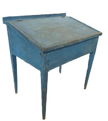 L483 Early 19th century Pennsylvania painted pine School Master's Desk with original dry blue paint and the initials �B.M.� prominently painted on the back. Desk rests on gracefully tapered hepplewhite legs that are mortised and pegged to the apron. Applied molding secured with sturdy square head nails surrounds the slanted lift lid that opens to reveal a clean, natural patina interior. Measurements: 31 &frac14;� wide x 21 &frac34;� deep x 34� tall (back) x 29 &frac12;� tall (front). Clearance from apron to floor is 21 &frac14;�. 