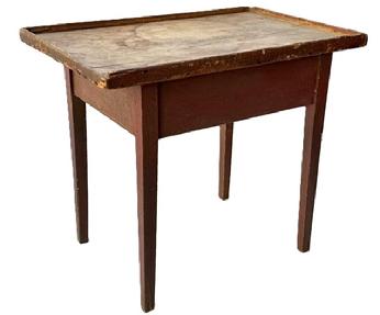 M265 Mid-19th century New England original red painted tray top table with one board, scrubbed top surrounded with applied gallery molding, resting on tapered legs. The apron is fully mortised and pegged into the legs. Square head nail construction. Measurements: 28 &frac14;� wide x 19� deep x 24 &frac12;� tall. (Apron to floor measures 17 &frac34;�).  