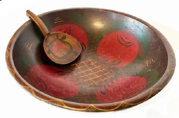 L120 Large identified Pennsylvania painted wooden bowl with tole painted interior featuring four large tomatoes and matching tole painted wooden butter paddle. The bowl is signed and dated on its slightly footed base: �Helen M Banks 1946� and the paddle is signed �H. Morris Banks� on its back. Mrs. Helen Morris Banks (1903-1977) from Mifflintown, PA taught the art of tole painting and she also organized the first public library in Juniata County, PA in the late 1930�s. The bowl measures: 18 &frac34;� x 20� top diameter x 5 &frac34;� deep. The butter paddle measures 9 5/8� long x 5 &frac34;� wide.  