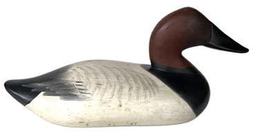 K159 Canvasback Decoy carved by Madison Mitchell (1901-1993) of Havre De Grace, MD in original paint.  Decoy is branded "L H C" in three locations on bottom. Missing the staple, ring and weight.  