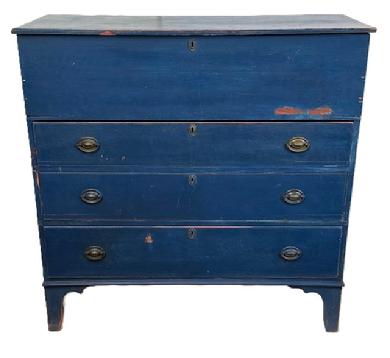L470 Early 19th century New England Mule Chest with old blue painted surface featuring hinged lift lid storage area over three dovetailed drawers with beaded edges and original hardware, resting on tall cut out feet. Applied battens on underside of lid.  The wood is pine with square head nail construction. Natural patina interior. Circa 1800-1820. Measurements:  42 &frac12;� wide x 18 &frac12;� deep x 42" tall. 