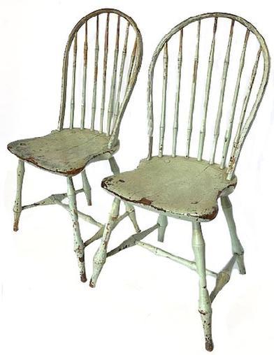 K1851 Pair of early 19th century Pennsylvania seven spindle bow back Windsor chairs bearing original painted surfaces. Circa 1800-1820. All original. Measurements: 16 &frac12;� wide across fronts x 15 &frac34;� deep x 37� tall back. The seats are 17 &frac12;� tall.   