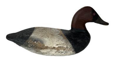 L42 Canvasback Drake Decoy carved by Taylor Boyd (1856-1946) of Perryville, Maryland. Branded "Grace" on bottom. Decoy retains working painted surface with areas of original paint showing through. Weight, staple and ring remain intact on bottom. Approximate measurements: 15 &frac14;� long x 6� wide x 7� tall.  
