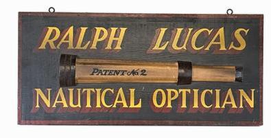 J321 Hand painted New England Trade Sign advertising �Ralph Lucas Nautical Optician� with applied wooden replica of a �No. 2� telescope. Measurements: 23 3/8� wide x 10 &frac34;� tall x 5/8� thick. (The applied wooden replica telescope measures 1 1/8� thick x 17 &frac14;� long x 3 1/8� tall.)