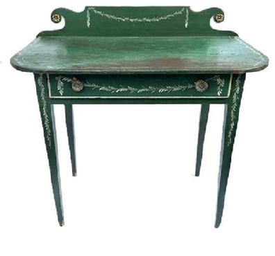 L127 19th century Country Hepplewhite Dressing Table bearing original green painted and white decorated surface featuring a scrolled backsplash and wide, dovetailed drawer and resting on tall gracefully tapered Hepplewhite legs. The wood is pine � and it is constructed with wooden pegs and cut nails. Measurements: 36� wide x 19� deep x 34 &frac34;� tall (back) x 29 &frac12;� tall (front).  Clearance from apron to floor is 23 &frac34;�.  