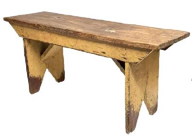 **SOLD** M246 Late 19th century Caroline County, Maryland original mustard painted bench with bootjack cut out feet and double drop aprons with shaped ends and original angled supports below the seat. The wood is yellow pine with wire nail construction. Very sturdy. Circa 1870s-1880s. Measurements: 37 &frac12;� wide x 11 &frac14;� deep x 17� tall.  