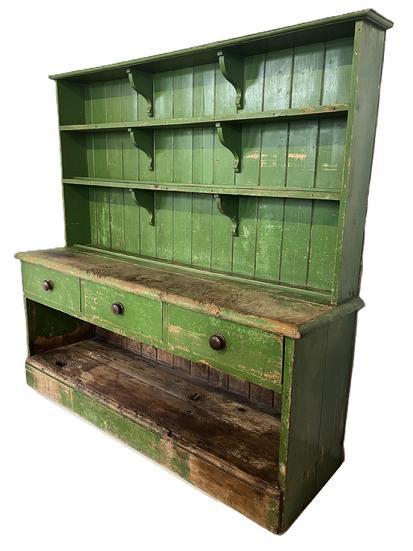 K1514 Very unique Pewter Cupboard in old green paint over mustard paint � with open top boasting shelves secured with decorative shelf supports. Each shelf bears attached molded plate stops. The bottom section boasts three dovetailed drawers over an open storage area that bears extensive wear. Circa 1850s. Found in Pennsylvania. The wood is white pine. Measurements: 68 &frac12;� wide x 19� deep x 65 &frac12;� tall. 