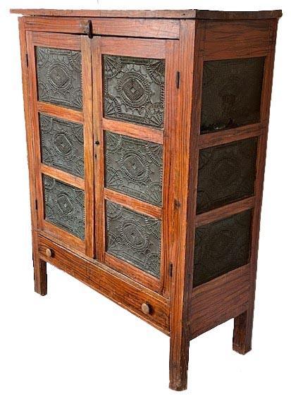 **SOLD** L83 Mid-19th century Pennsylvania original paint decorated pie safe with twelve very ornate tins The tins retain remnants of green painted surfaces. Two doors over one drawer configuration. Clean, natural patina interior. The wood is pine. Circa 1850s. Measurements: 44� wide x 18� deep x 56 &frac14;� tall. 
